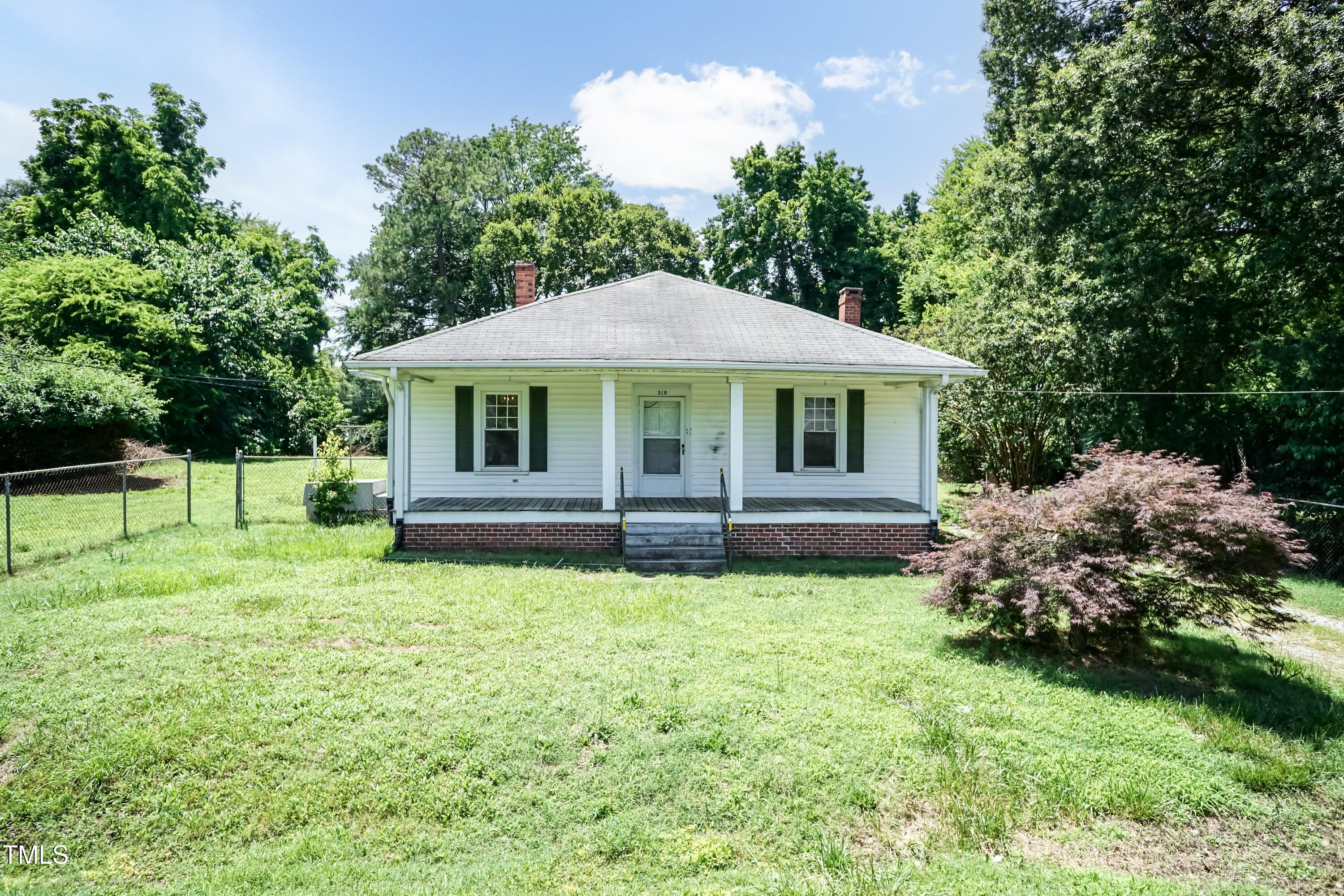310 Spring Street Durham, NC 27703 - Photo 4 of 43 a front view of a house with garden