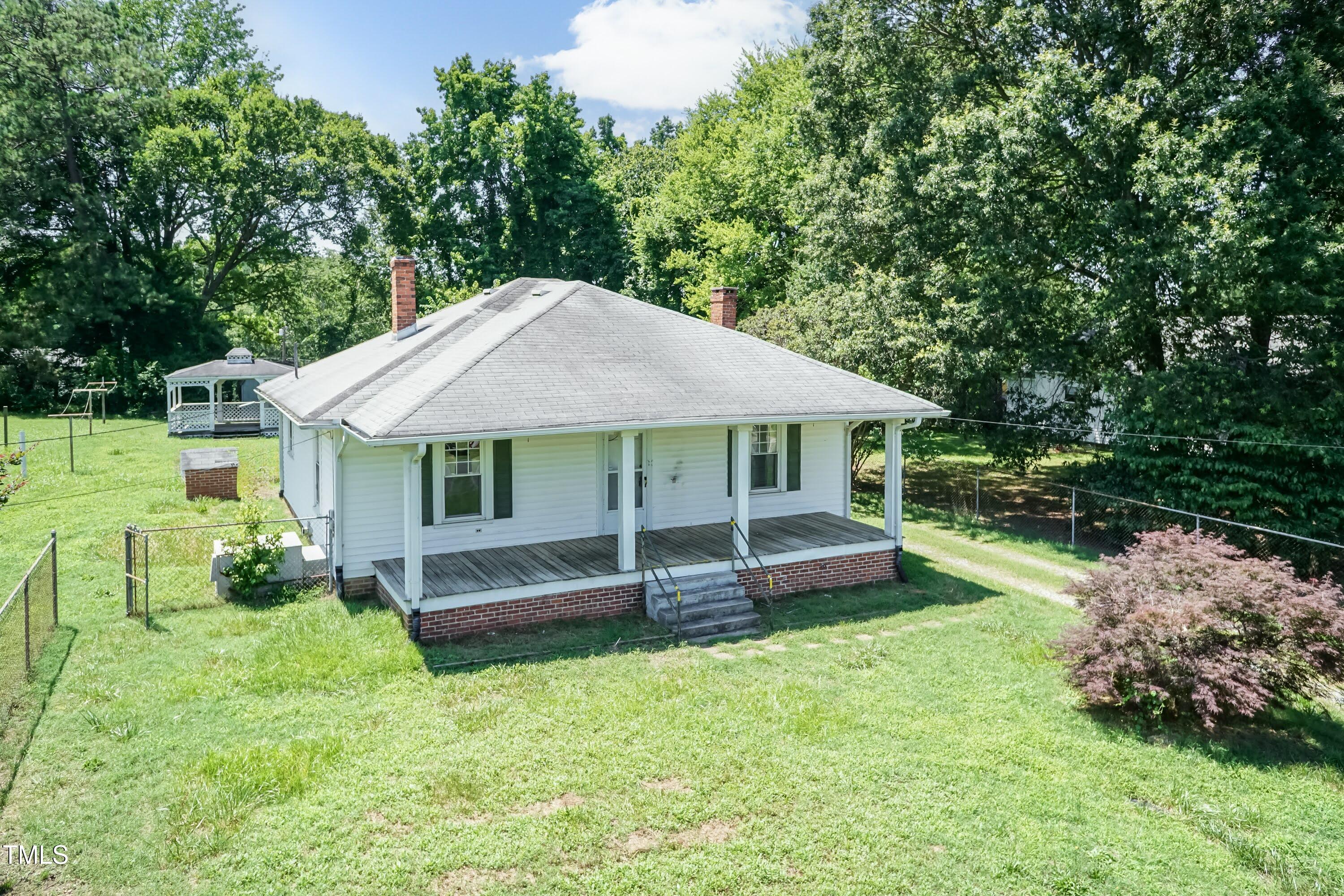 310 Spring Street Durham, NC 27703 - Photo 5 of 43 a front view of a house with a yard