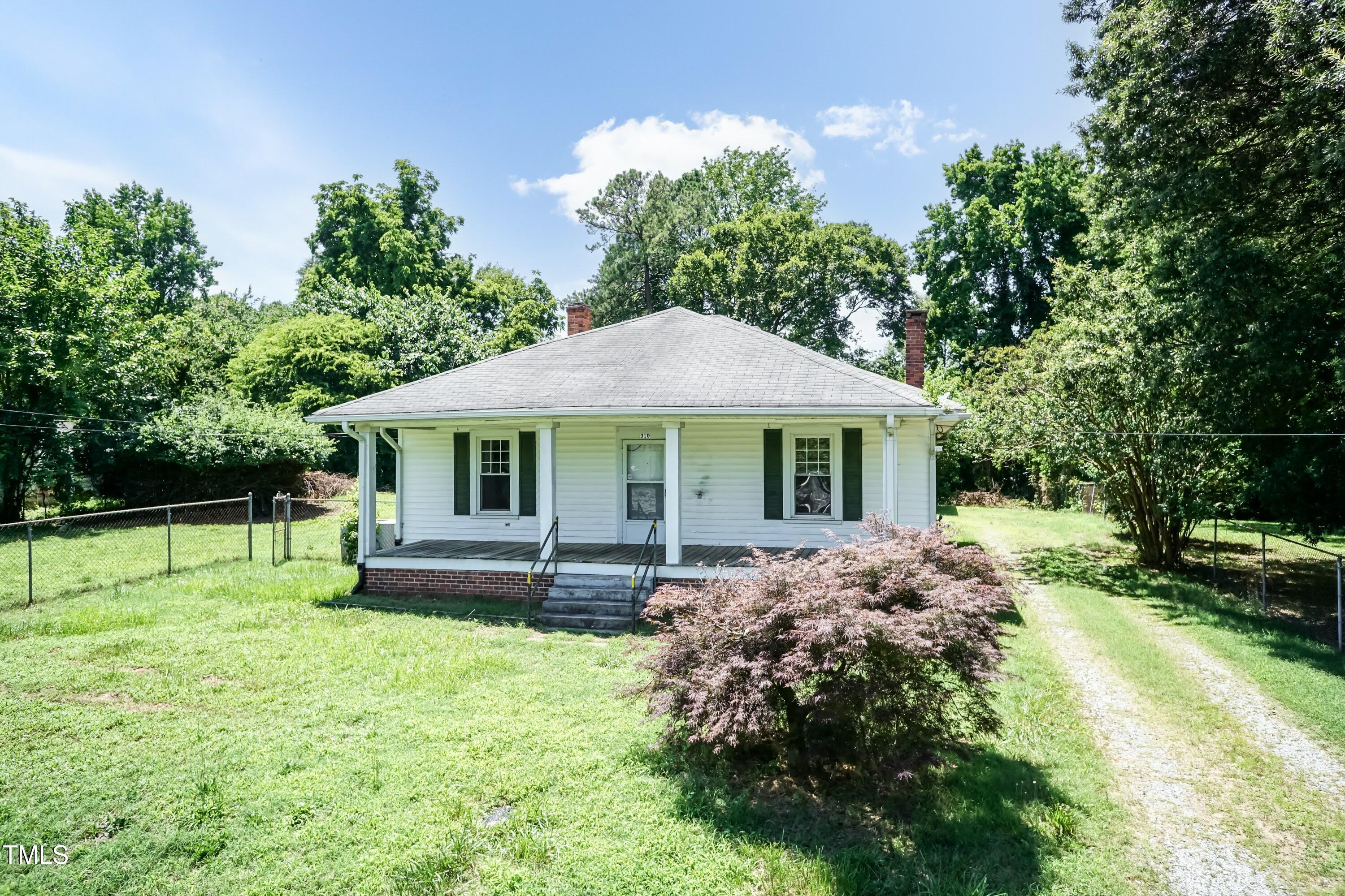310 Spring Street Durham, NC 27703 - Photo 6 of 43 a front view of house with yard and trees