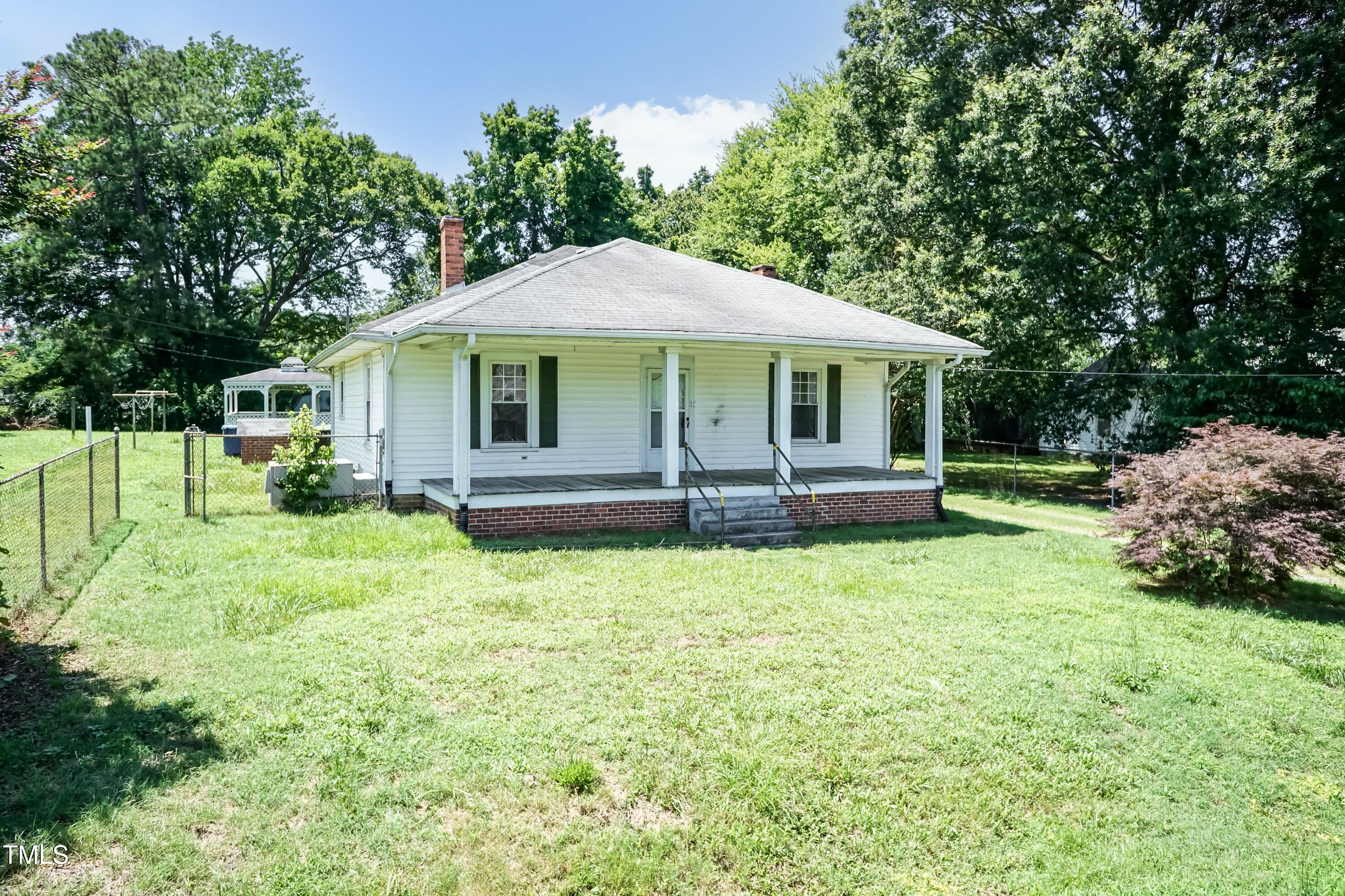 310 Spring Street Durham, NC 27703 - Photo 9 of 43 a front view of a house with garden