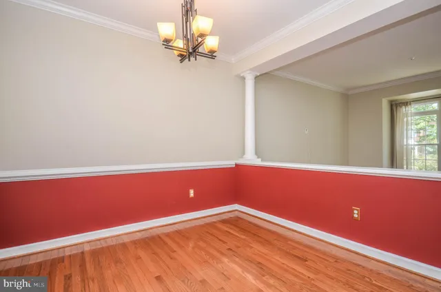 a view of room with wooden floor and fan