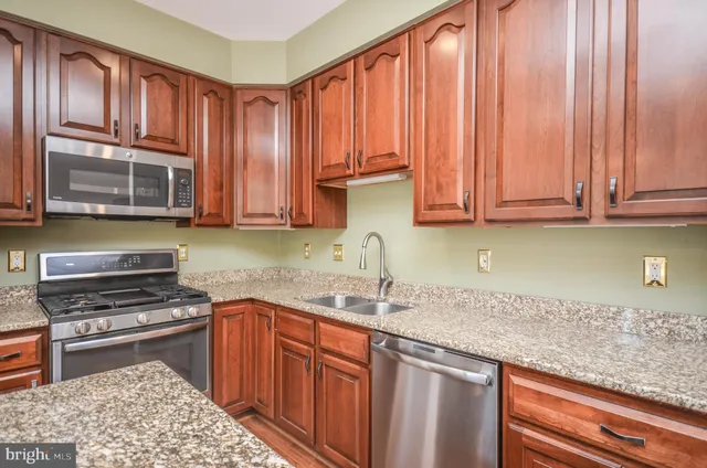 a view of a living room and kitchen