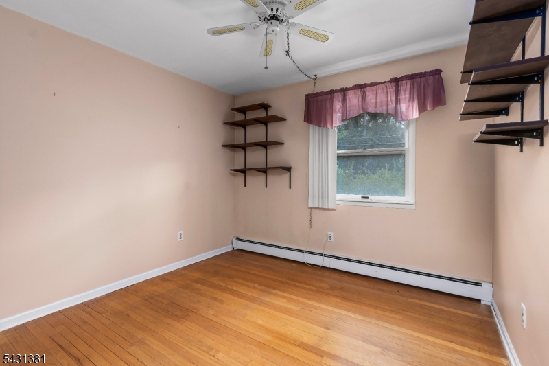1089 Green Pond Road Newfoundland, NJ 07435 - Photo 16 of 34 wooden floor in an empty room with a window