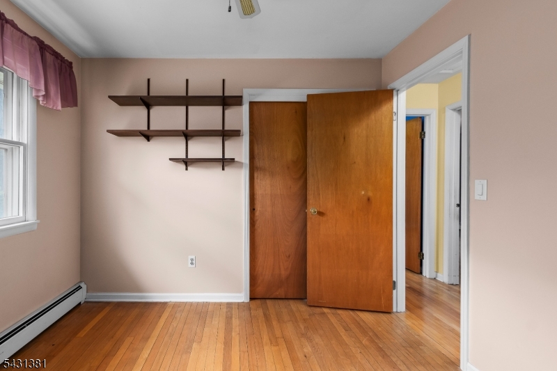 1089 Green Pond Road Newfoundland, NJ 07435 - Photo 17 of 34 a view of a room with wooden floor and small window