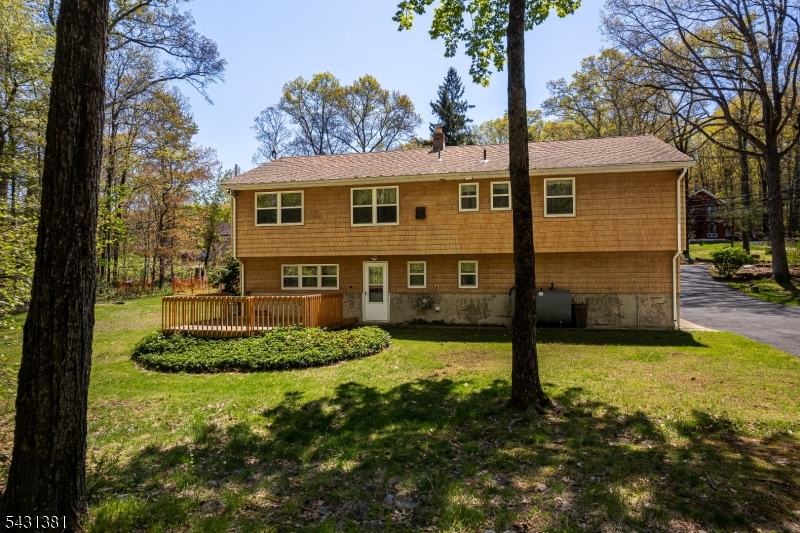 1089 Green Pond Road Newfoundland, NJ 07435 - Photo 30 of 34 a backyard of a house with yard table and chairs