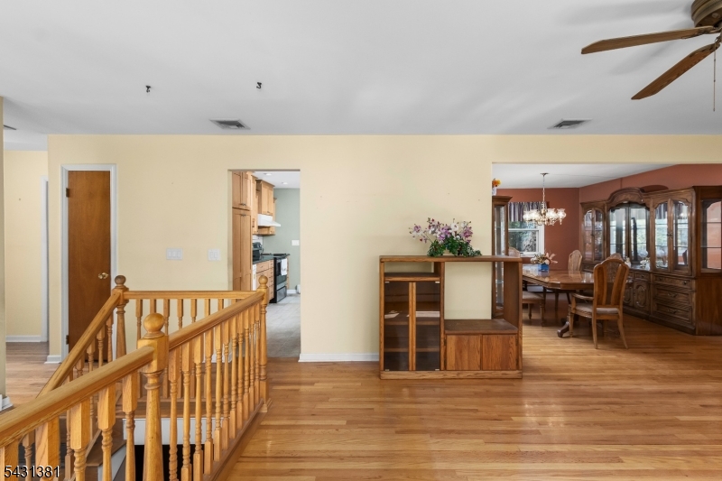 1089 Green Pond Road Newfoundland, NJ 07435 - Photo 3 of 34 a view of a living room and kitchen with furniture wooden floor and window