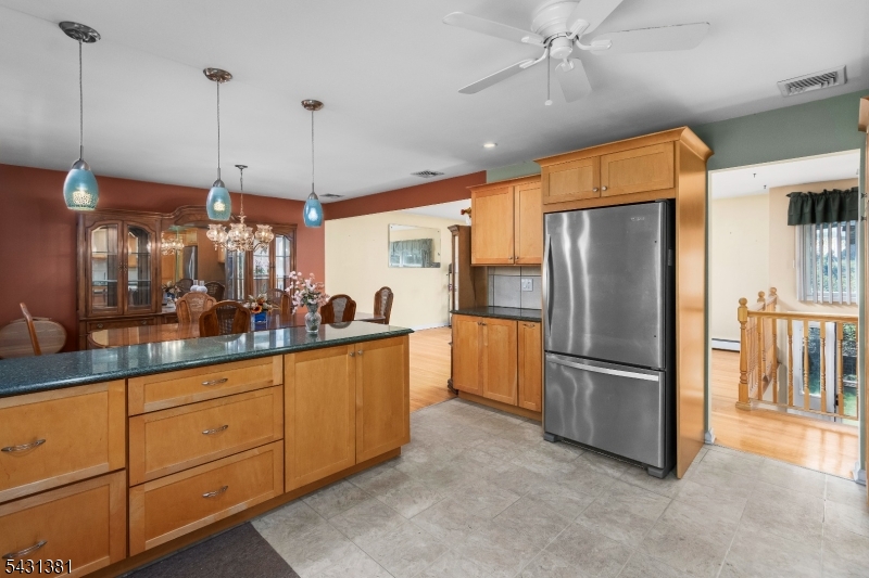 1089 Green Pond Road Newfoundland, NJ 07435 - Photo 8 of 34 a kitchen with stainless steel appliances granite countertop a refrigerator a oven and a sink with cabinets