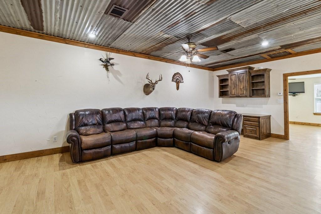 800 County Road 2807 Mabank, TX 75147 - Photo 17 of 39 a living room with furniture ceiling fan and a rug