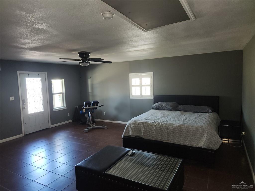 3021 Nyssa Avenue McAllen, TX 78501 - Photo 20 of 24 a bedroom with a bed and glass windows