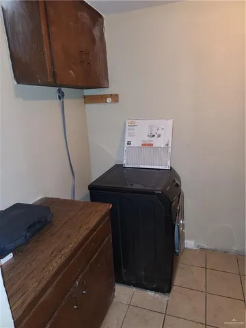 a bathroom with a sink and a washer dryer