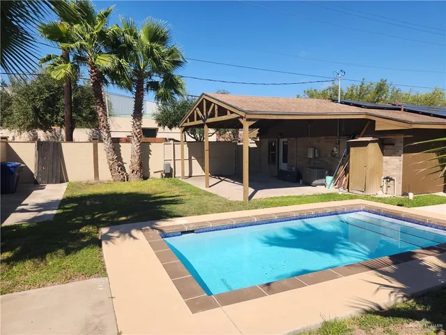 a view of a house with swimming pool