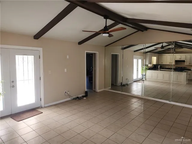 a view of a kitchen with a sink and cabinets
