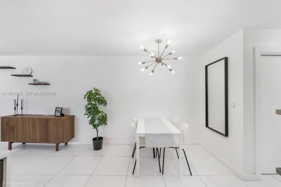 710 11th Street, Unit 8 Miami Beach, FL 33139 - Photo 11 of 15 a living room with furniture and flowers