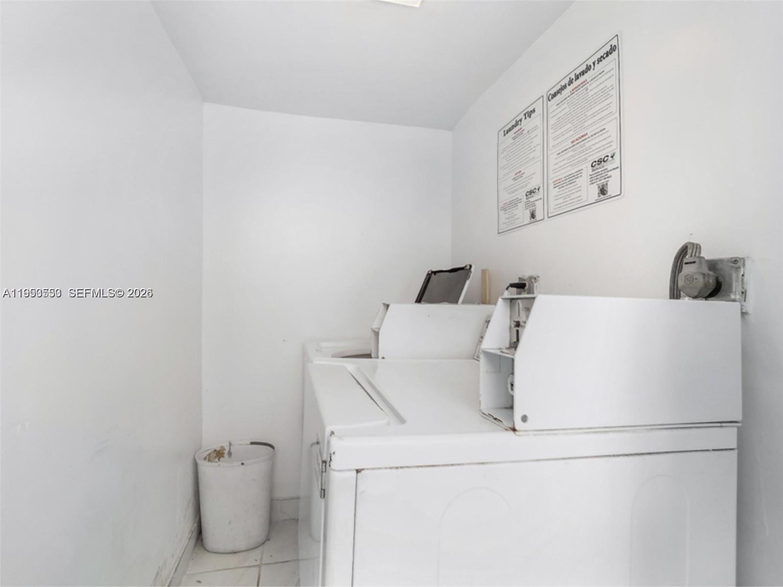 710 11th Street, Unit 8 Miami Beach, FL 33139 - Photo 15 of 15 a utility room with dryer and washer