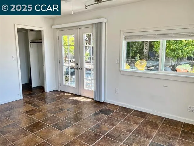 a view of an empty room and window