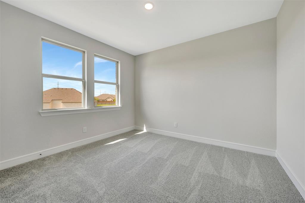 11460 Wulstone Road Fort Worth, TX 76052 - Photo 28 of 40 an empty room with a window