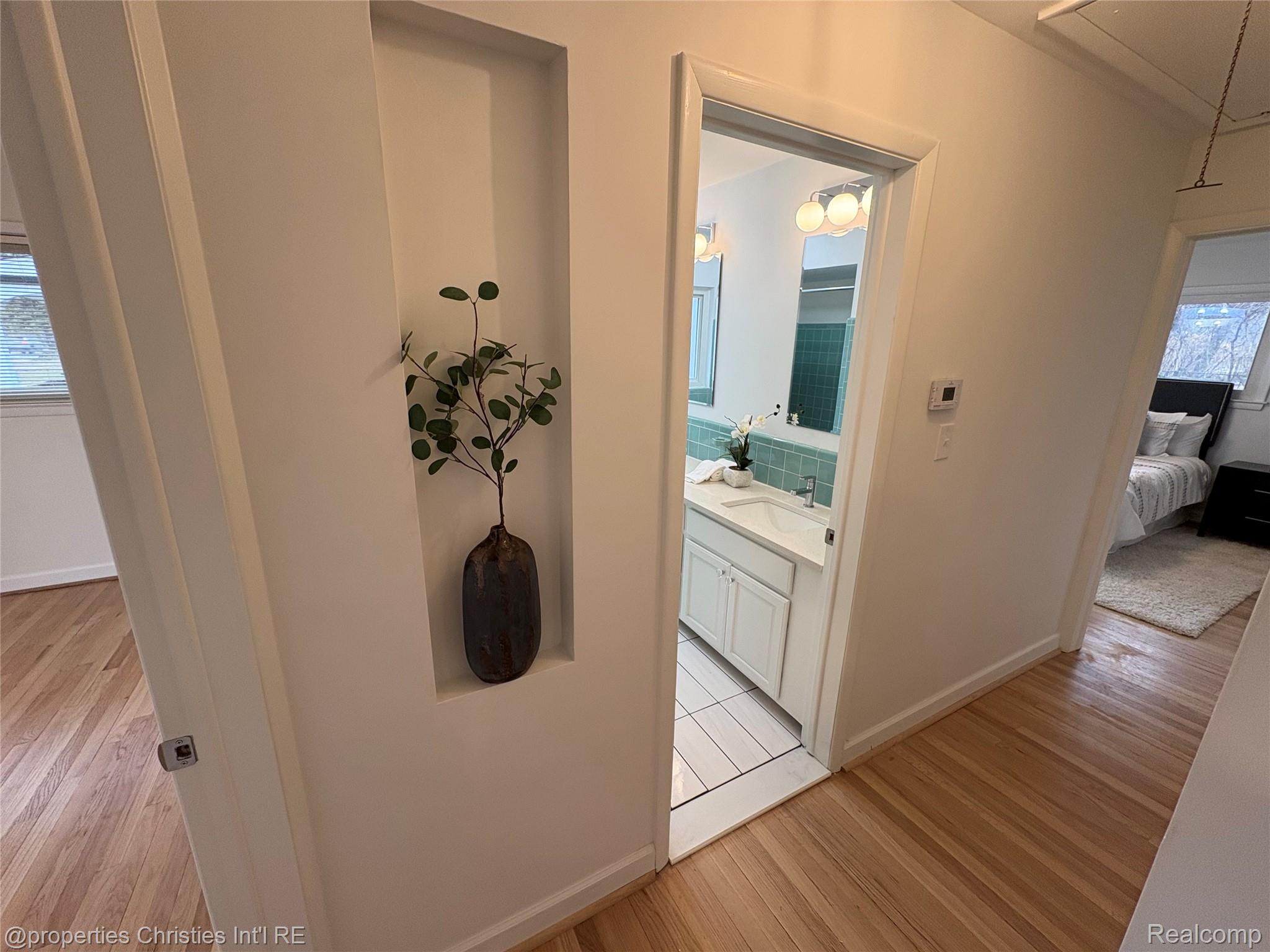 17330 Beverly Road Franklin, MI 48025 - Photo 10 of 24 Corridor featuring light wood-type flooring