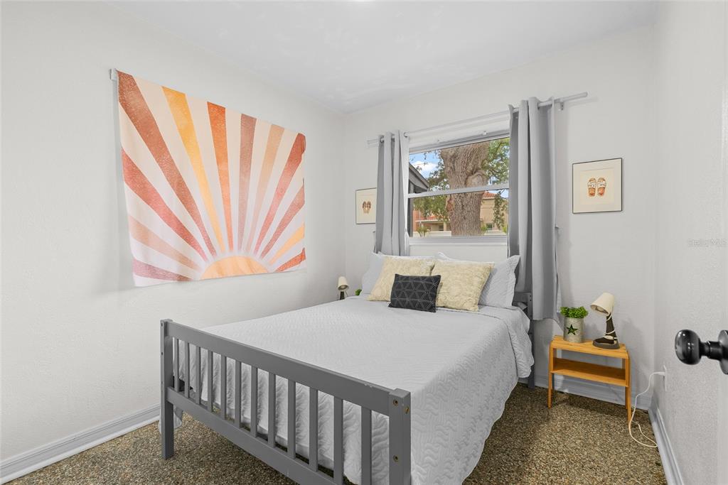 4939 100th Way North St. Petersburg, FL 33708 - Photo 24 of 43 a bedroom with a bed and a window