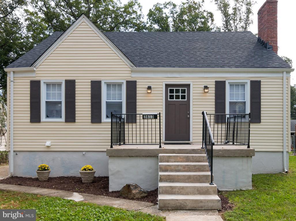 3613 Forest Hill Road Baltimore, MD 21207 - Photo 1 of 27 a front view of a house with a yard