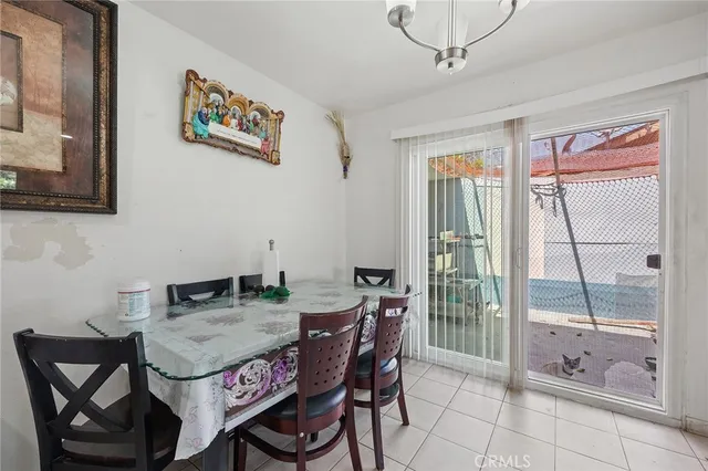 a bedroom with bed and wooden floor