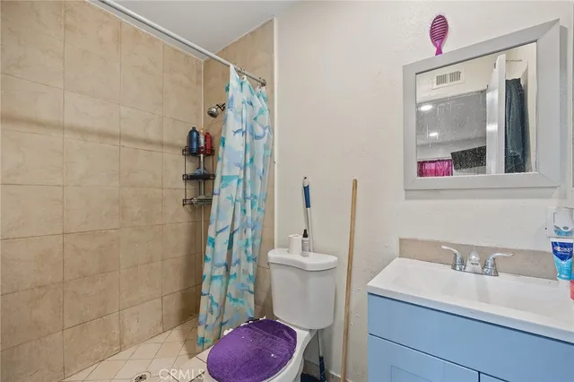 a kitchen with a stove and white cabinets