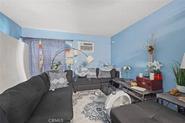 a kitchen with kitchen island white cabinets stove and sink