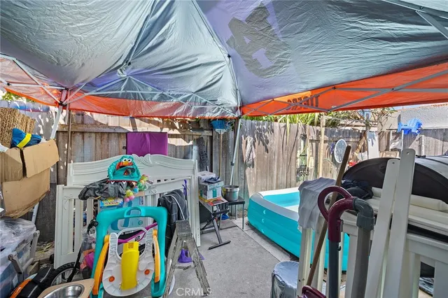 a living room with furniture and a book shelf