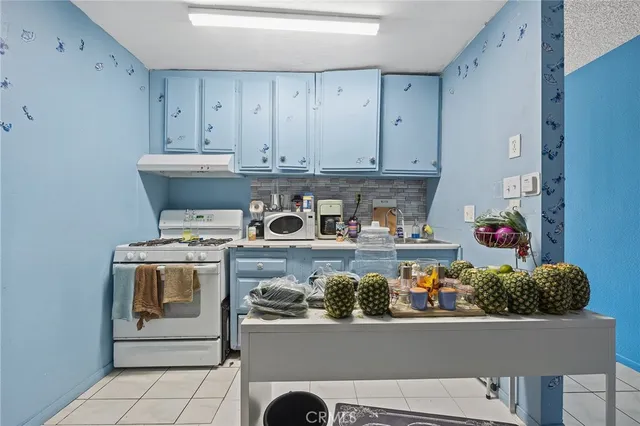 a bathroom with a sink toilet vanity and shower