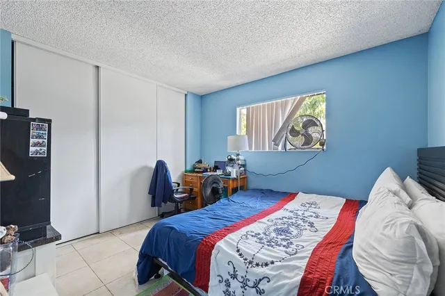 a view of game room with windows and white walls