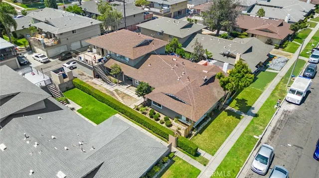 an aerial view of a house with a yard