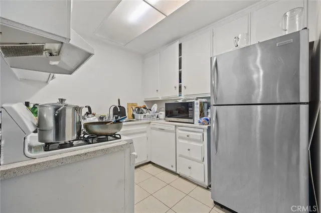 a view of a patio with couches and potted plants