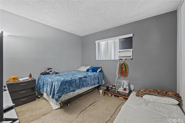 a view of a dining room with furniture wooden floor and a chandelier