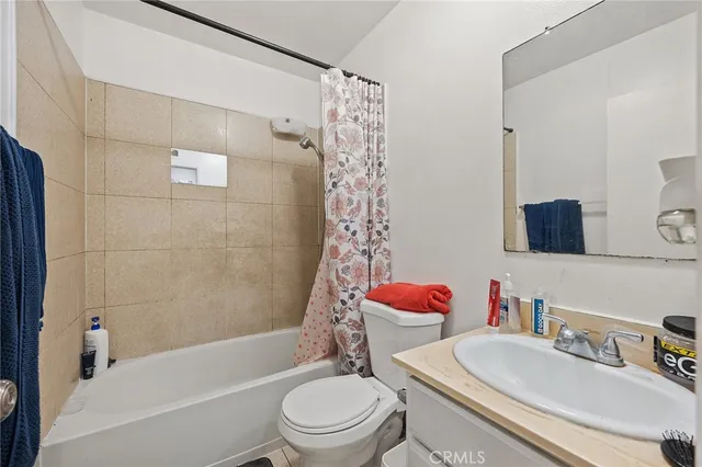 a kitchen with stainless steel appliances granite countertop a refrigerator sink and white cabinets