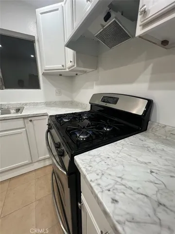 a view of a car parked in front of a house