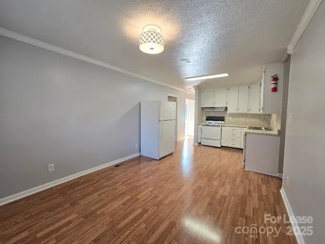 a view of kitchen with wooden floor