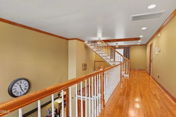 a view of an entryway with wooden floor
