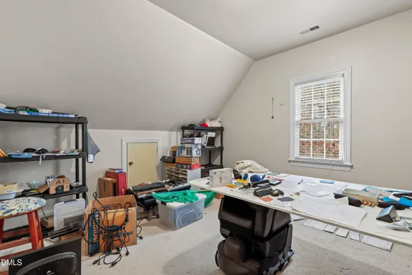 a room that has a couch and a dresser in it