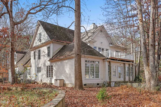 a view of yard with wooden fence