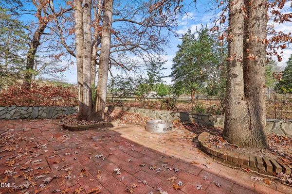 a view of yard with wooden fence
