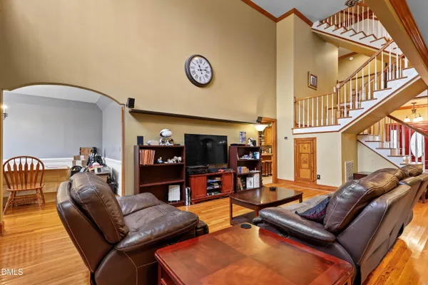 a living room with furniture a fireplace and a large window