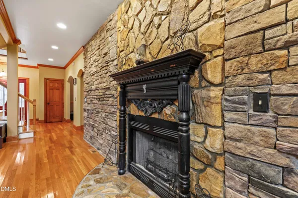a bedroom with a bed and a fireplace