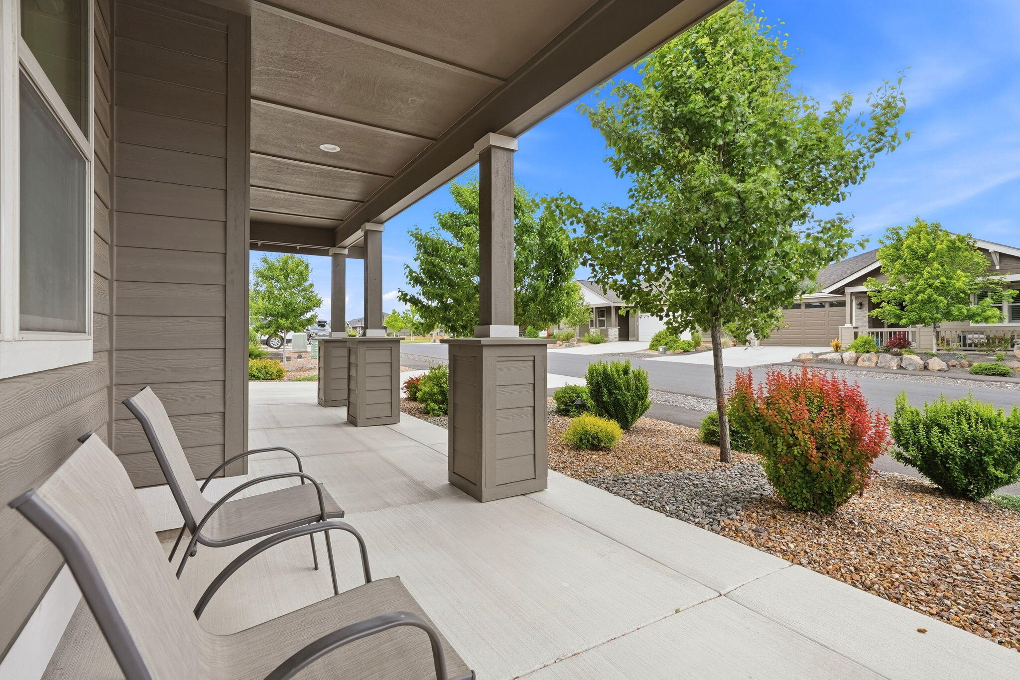 2714 Northwest 23rd Street Redmond, OR 97756 - Photo 2 of 57 a view of a patio with table and chairs potted plants and floor to ceiling window