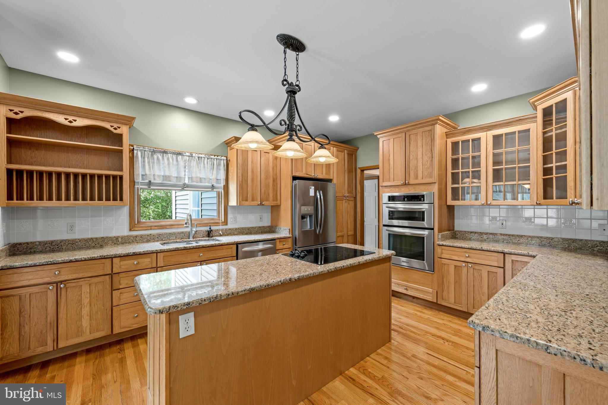 113 Bentons Pleasure Road Chester, MD 21619 - Photo 18 of 53 Warm wood tones in a spacious kitchen.