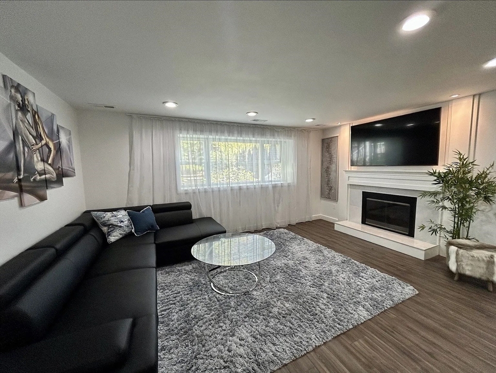 6 Temple Street Framingham, MA 01702 - Photo 18 of 34 a living room with furniture and a fireplace