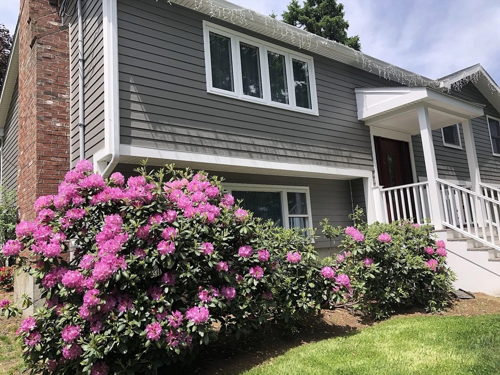 6 Temple Street Framingham, MA 01702 - Photo 2 of 34 a view of a house that has a flower garden