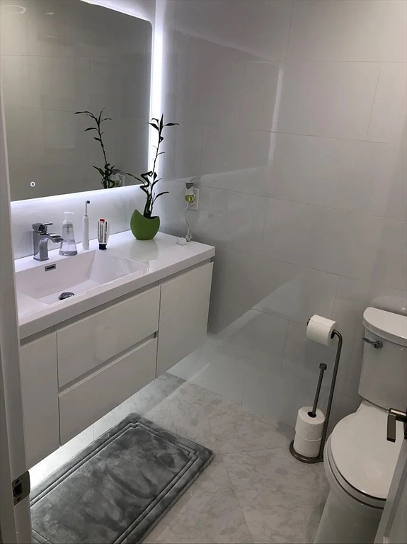 6 Temple Street Framingham, MA 01702 - Photo 24 of 34 a bathroom with a sink and a toilet