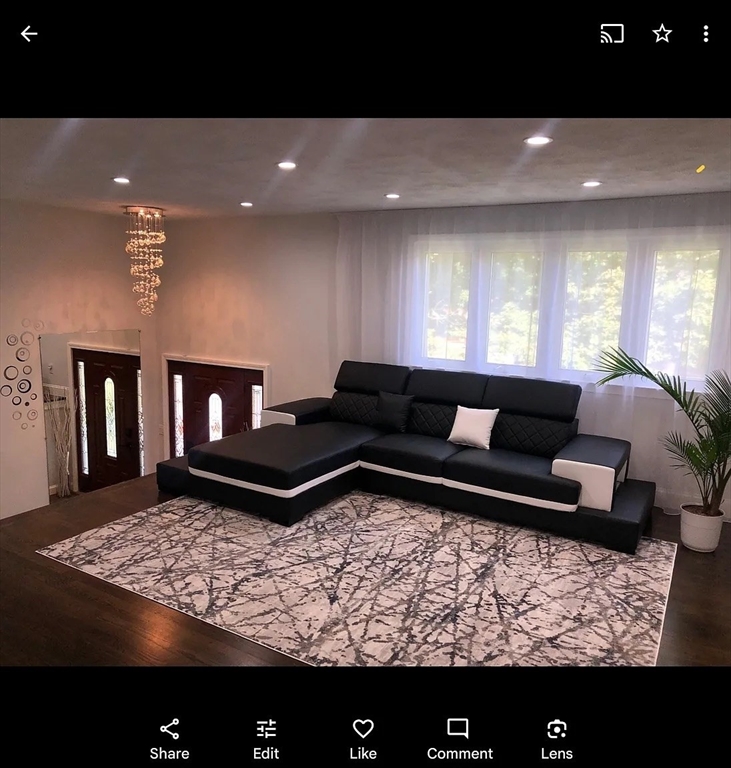 6 Temple Street Framingham, MA 01702 - Photo 32 of 34 a living room with furniture and a rug