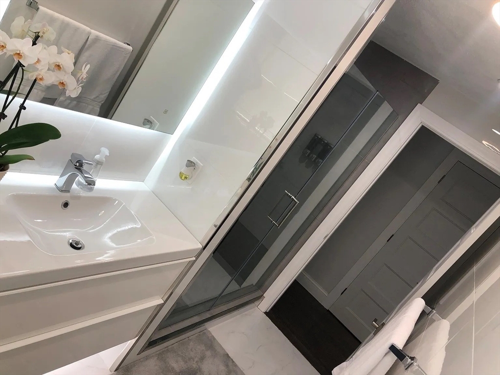 6 Temple Street Framingham, MA 01702 - Photo 6 of 34 a bathroom with a sink and mirror