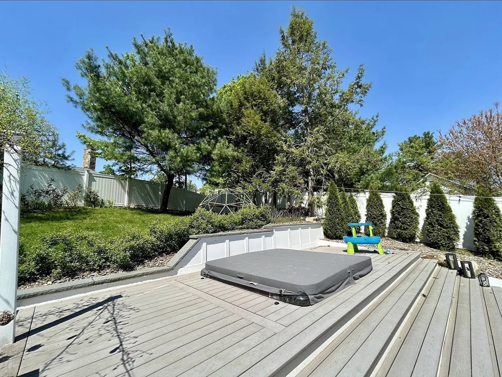 6 Temple Street Framingham, MA 01702 - Photo 9 of 34 a view of a patio with a table and chairs and couches with wooden floor and fence