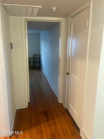 a room with a sink and a mirror